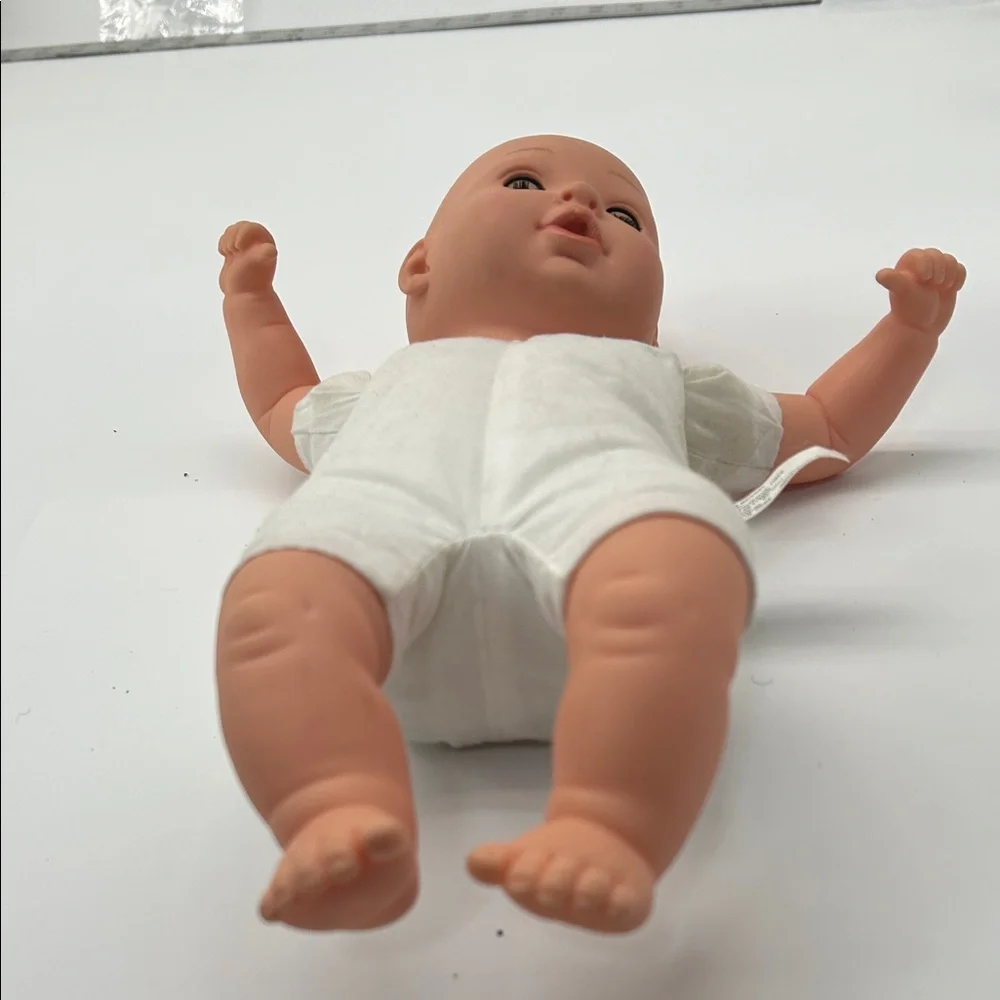 Realistic Baby Doll with White Outfit